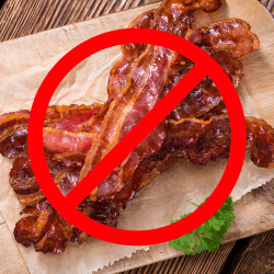 a photo of cooked bacon on a cutting board